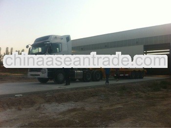 howo a7 tractor truck with 3 axle low bed semi trailer