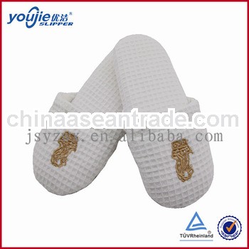white embroidered waffle non-skid hospital slippers