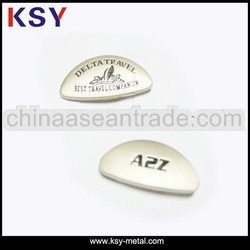 logo metal casting with black writing