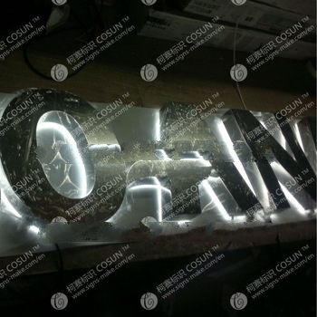 Behind illuminated shop signs