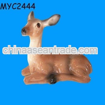 Painted ceramic sitting deer figurine
