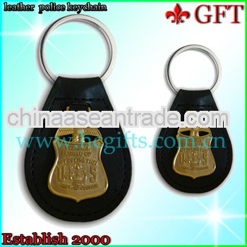Promotional brass badge with leather keychain