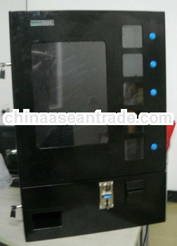 Wall mounted vending machine for cigarette/chewing gums/ napkins/ medicine
