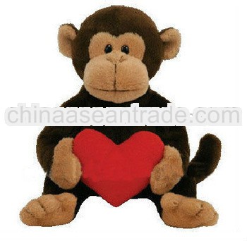 brown monkey soft toys holding heart