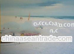 Fishermen with boats on the seafront.