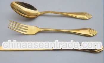 full gold spoon fork and knife
