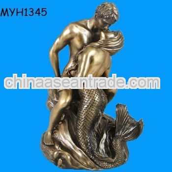 golden mermaid figurine