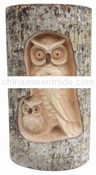 Wooden owl in log