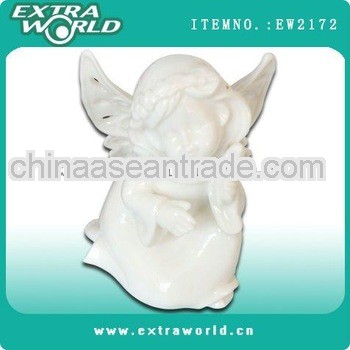 kneeing white porcelain cherub