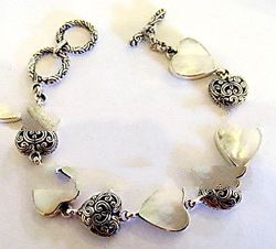 Silver Bracelet With Heart Carving And Heart Shell