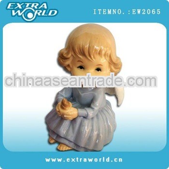 porcelain angel holding candle