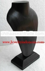 Necklace holders in wood bust for jewelry.