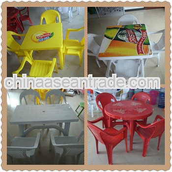 white plastic outdoor table and chair