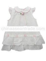 white baby girls dress with little flower