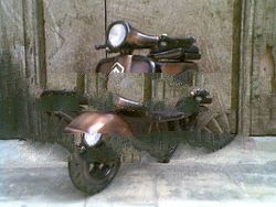 miniature metal Vespa motorcycle