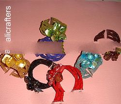 Flowered shell on clip-on beaded bracelet