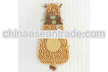 Giraffe-inspired snuggle sack and cap as cloth for baby