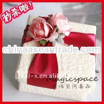 Paper chocolate box with ribbon and flower