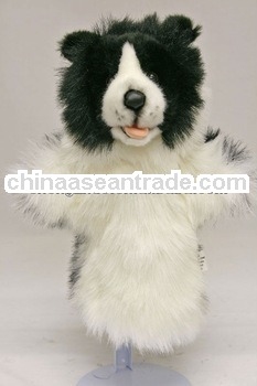 Plush black and white lifelike and cuddly small hand puppet
