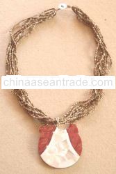 Bali resin, sea shell, bone, wood, mother pearl pendant
