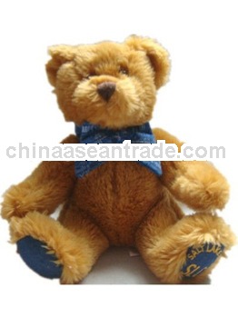 plush bear soft toy with blue bow