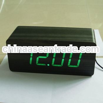 touch on blue wooden table led clock